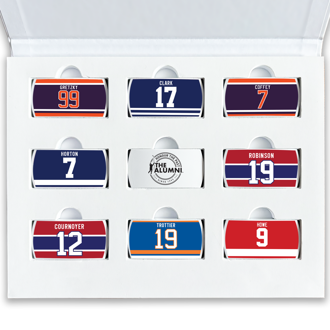 A top-down view of nine ZippyBack™ wearable collectibles from the Rafters Series 1 set, each an officially licensed NHL Alumni Association nameplate for a different retired player.