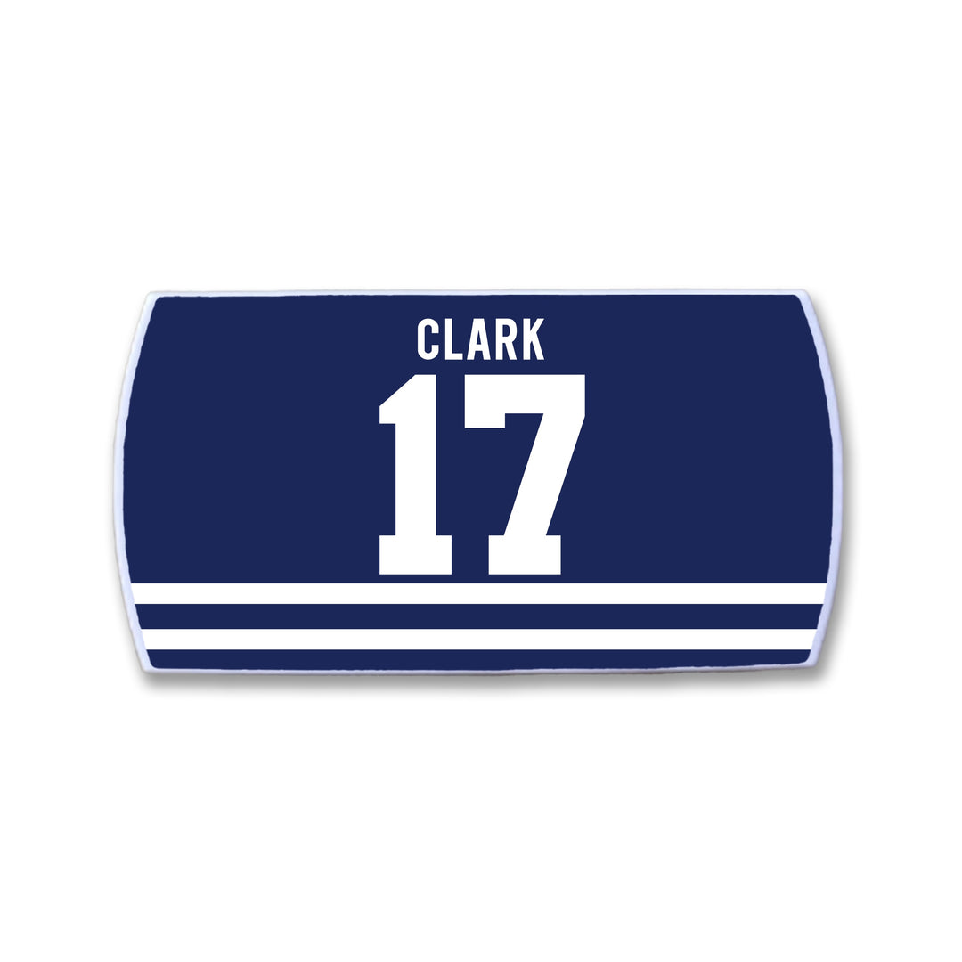 The ZippyBack™ Wendel Clark patch is navy blue and rectangular, with "CLARK" in white above the number 17 to honor hockey legend Wendel Clark. Three horizontal white stripes at the bottom symbolize commitment.