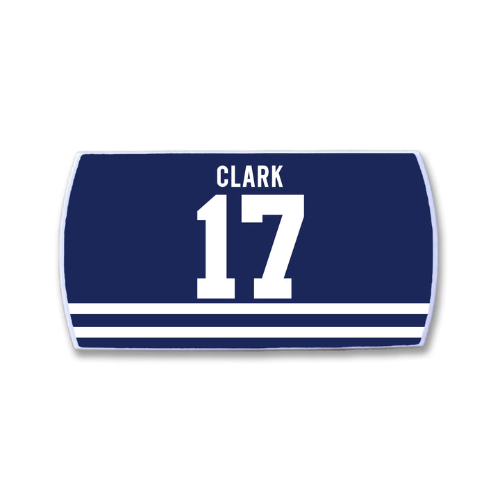 The ZippyBack™ Wendel Clark patch is navy blue and rectangular, with "CLARK" in white above the number 17 to honor hockey legend Wendel Clark. Three horizontal white stripes at the bottom symbolize commitment.