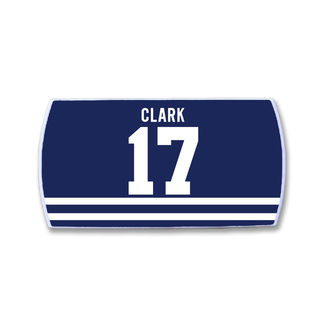 A dark blue rectangular ZippyBack™ patch with "Wendel Clark" above a large 17 and three white stripes along the bottom, honoring Clark's scoring touch and physical edge on the ice.