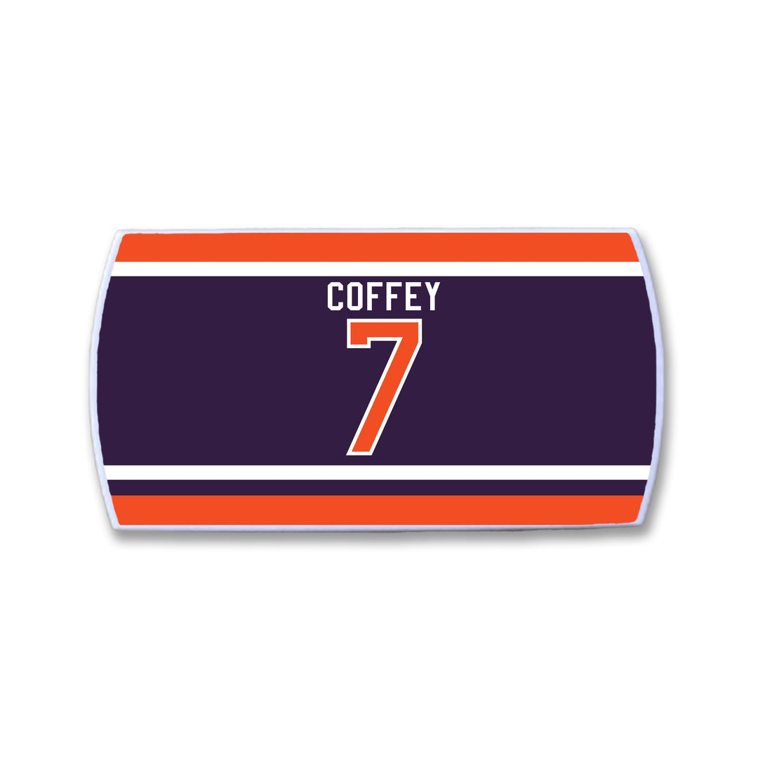 Rectangular ZippyBack™ item resembling a hockey jersey nameplate, dark blue with “COFFEY” and number “7” in white/orange, bordered by stripes. Part of the Limited Edition Rafters Series 1 honoring Paul Coffey.