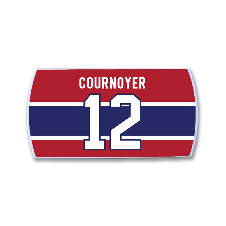 The ZippyBack™ Yvan Cournoyer nameplate features white text and number 12 on red, accented by a navy blue stripe—a tribute to the hockey legend's speed.
