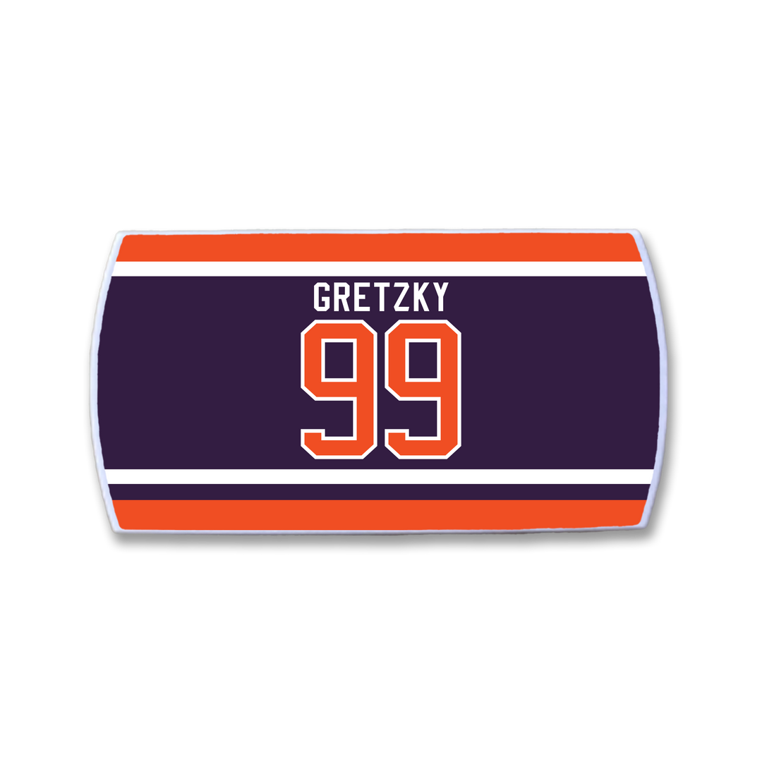 A rectangular ZippyBack™ patch featuring Wayne Gretzky's name and number 99 in orange on dark blue with orange and white stripes, inspired by classic hockey jerseys.