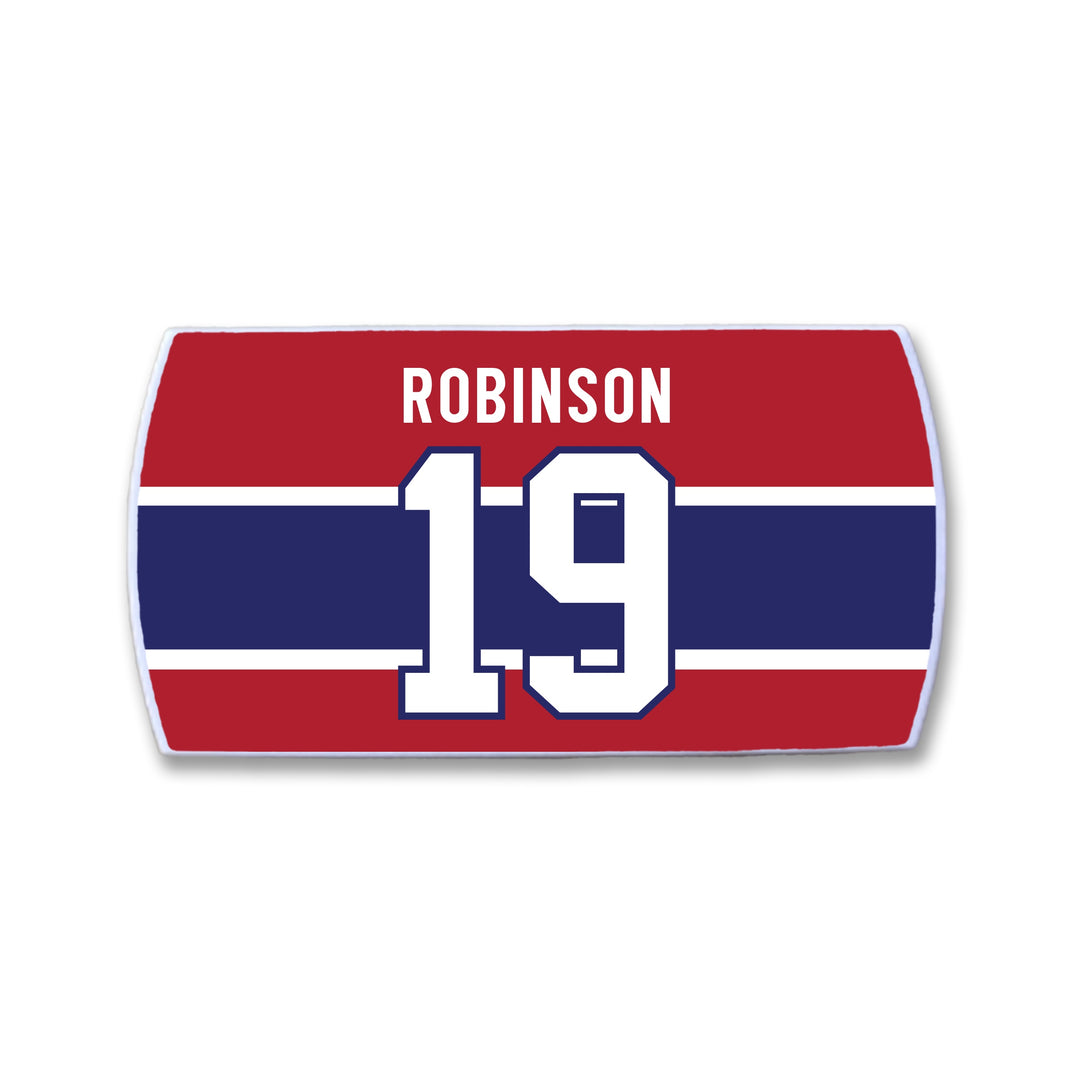 A rectangular red ZippyBack™ nameplate with a bold blue stripe and white borders. "ROBINSON" is at the top in white, honoring defenseman Larry Robinson, with a large white 19 centered below.