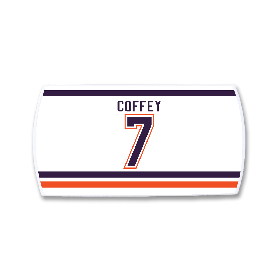 The ZippyBack™ Paul Coffey nameplate is a white hockey jersey patch with his name in black above the number 7, both outlined in orange and black, and features bold horizontal blue, orange, and white stripes.