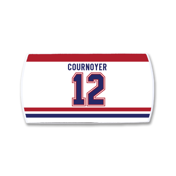 The ZippyBack™ Yvan Cournoyer hockey jersey nameplate features "COURNOYER" and number 12 in bold blue and red on white, celebrating his legendary speed, with striking red and blue stripes.