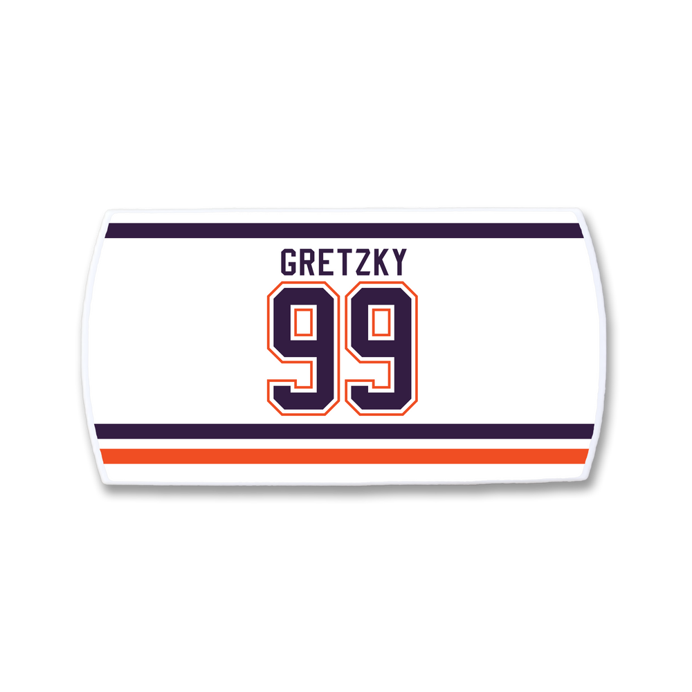 The ZippyBack™ Wayne Gretzky sports jersey nameplate displays "GRETZKY" above a bold, outlined number 99, with navy and orange stripes at the top and bottom—perfect for hockey fans.