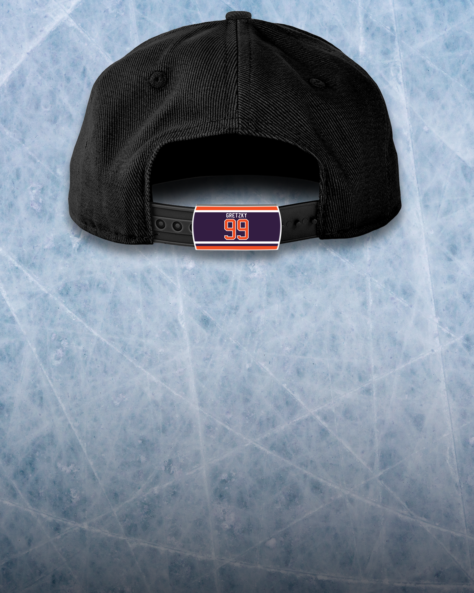 A black baseball cap shown from the back, with a snapback closure. The ice-hockey style background features a nameplate labeled GRETZKY 99 in blue and orange colors on the caps strap.