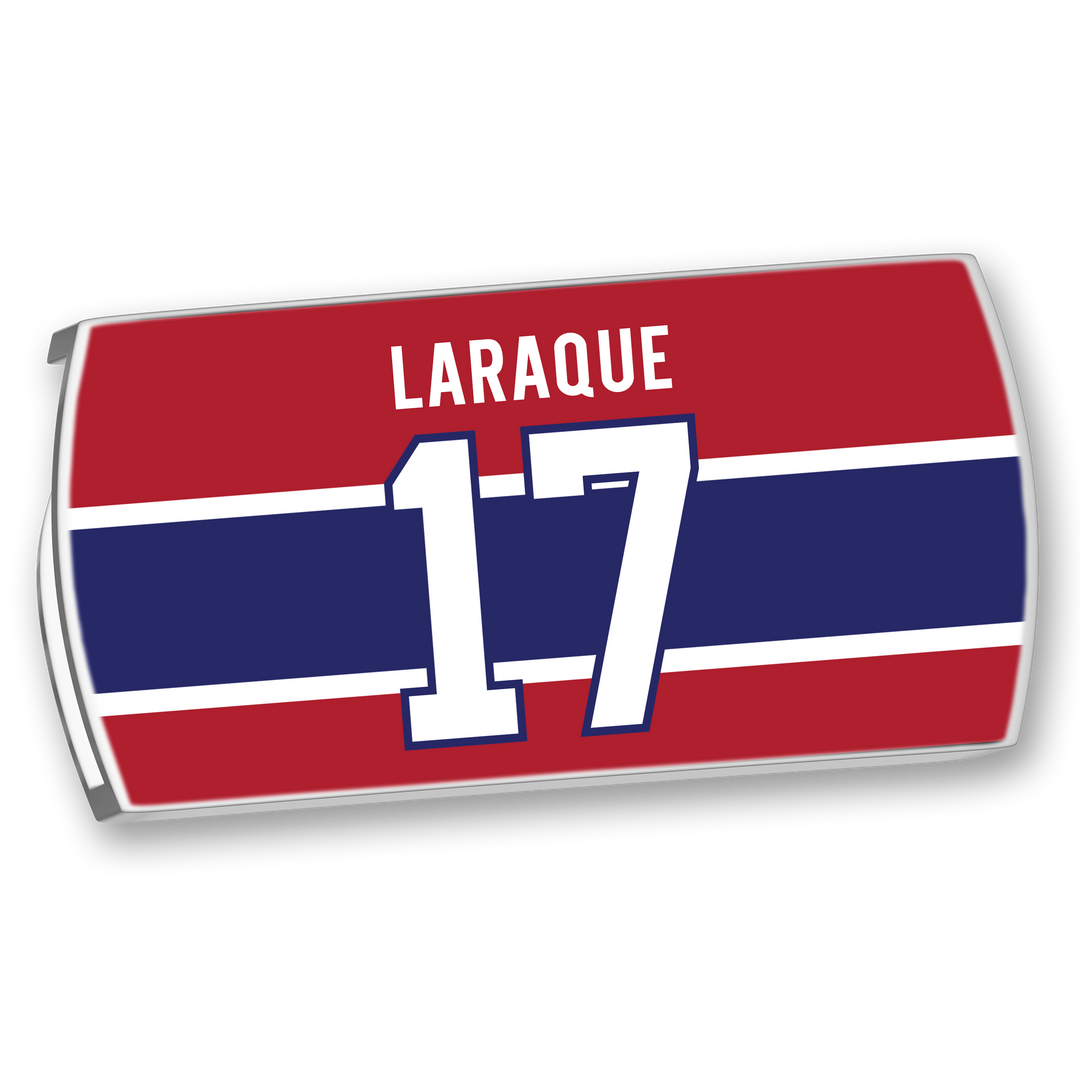 The ZippyBack™ Georges Laraque red hockey jersey nameplate displays "Laraque" above the number 17, set against blue and white stripes—showcasing heavyweight presence, strength, and discipline.