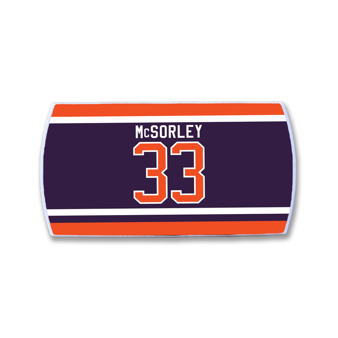 The ZippyBack™ Marty McSorley hockey-style nameplate displays his name and number 33 in bold white and orange on a navy background, accented with red and white stripes.