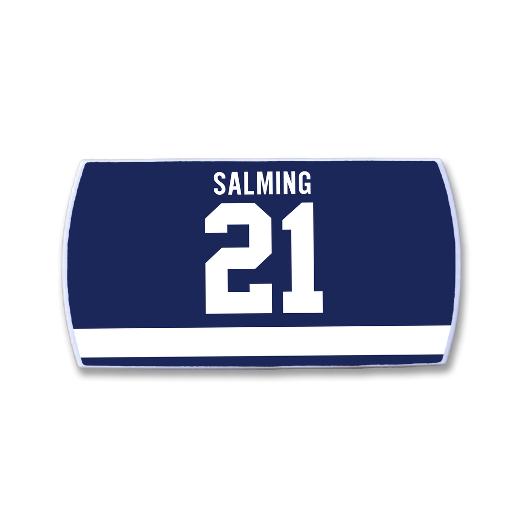The ZippyBack™ Börje Salming jersey nameplate features SALMING in white above the number 21 on navy blue, with a white stripe below—honoring his legendary skill and toughness.