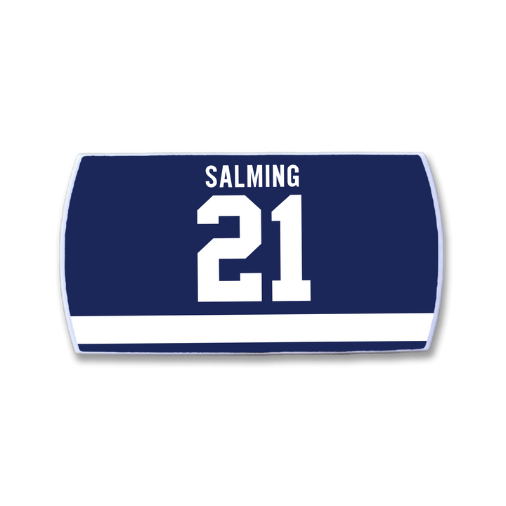 The ZippyBack™ Börje Salming jersey nameplate features SALMING in white above the number 21 on navy blue, with a white stripe below—honoring his legendary skill and toughness.