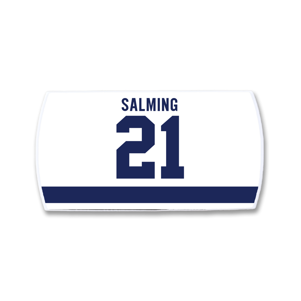 ZippyBack™ Börje Salming white rectangular hockey jersey nameplate features SALMING in blue capitals above number 21 and a bold blue stripe, celebrating the legendary player's skill and toughness.