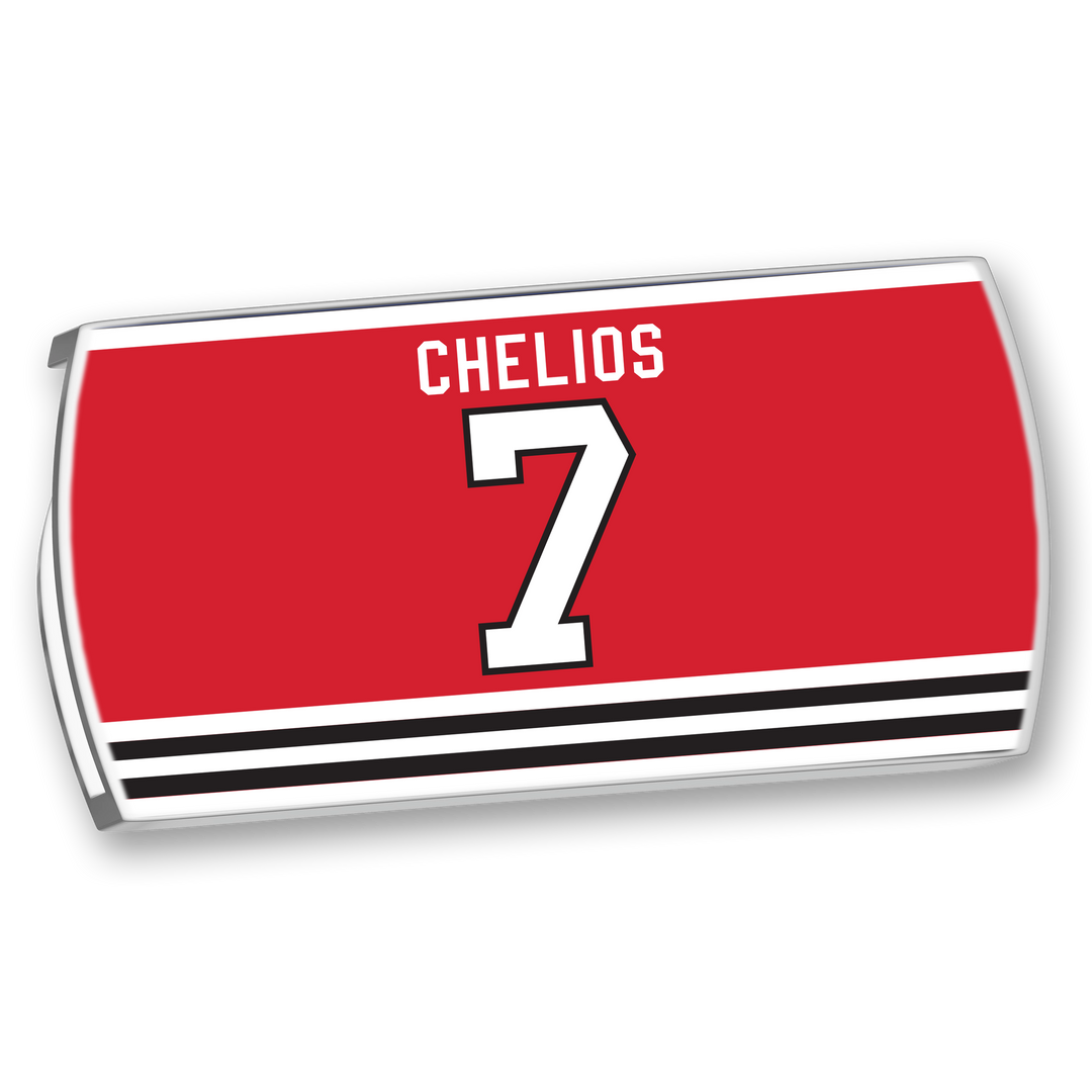 Rectangular image of a ZippyBack™ Chris Chelios red hockey jersey nameplate with "CHELIOS" in white above a large white 7, featuring black and white stripes along the bottom.