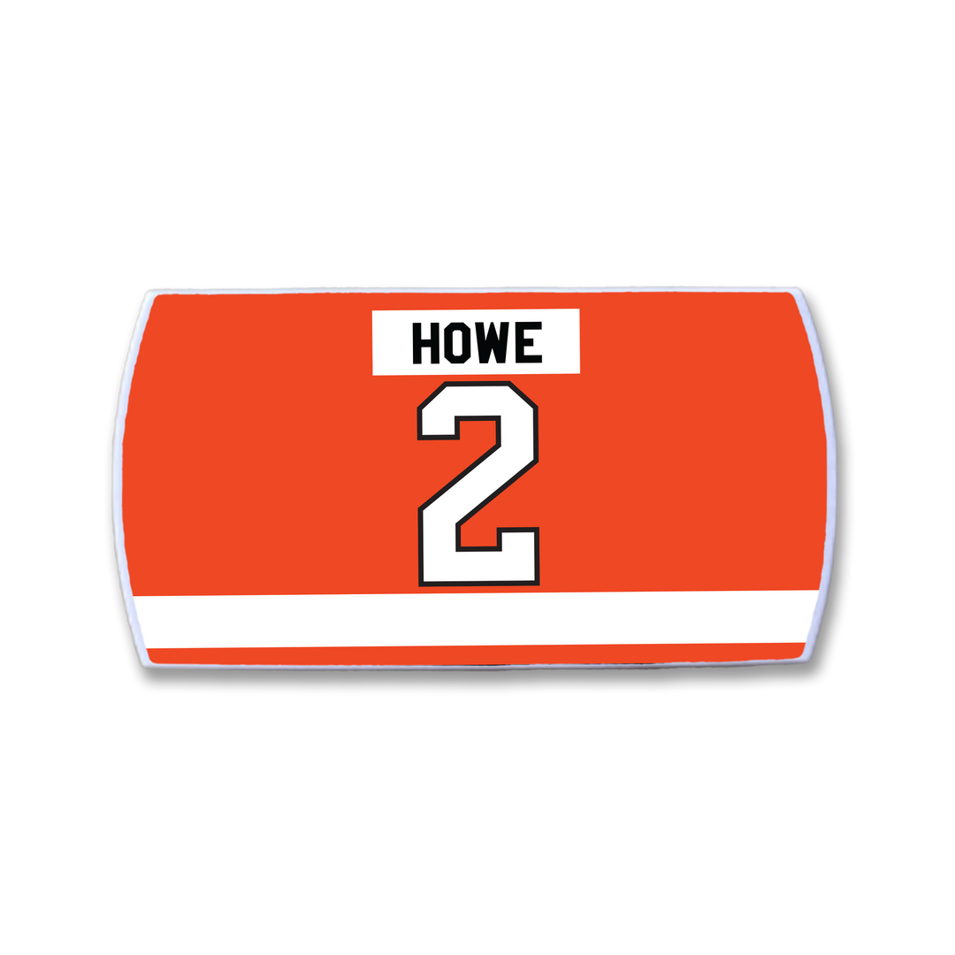 Celebrate intelligent defenseman Mark Howe with the ZippyBack™ Mark Howe red hockey jersey nameplate: "HOWE" in black above a white, black-outlined number 2 and a white horizontal stripe near the bottom—a tribute to his signature smooth first pass.