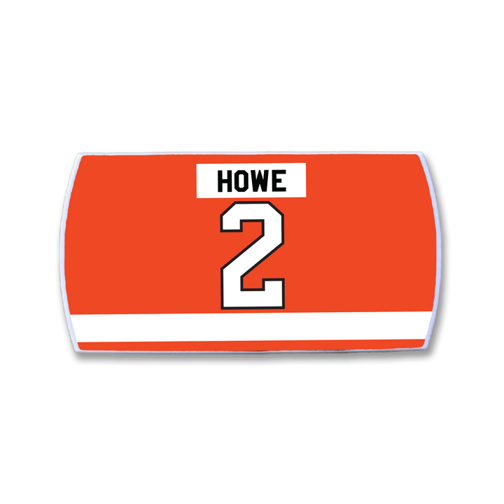 Celebrate intelligent defenseman Mark Howe with the ZippyBack™ Mark Howe red hockey jersey nameplate: "HOWE" in black above a white, black-outlined number 2 and a white horizontal stripe near the bottom—a tribute to his signature smooth first pass.