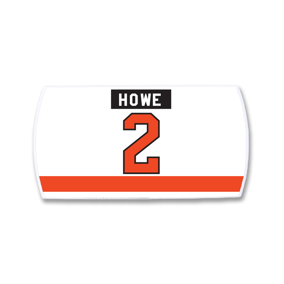 The ZippyBack™ Mark Howe nameplate is a rectangular white hockey patch with "HOWE" in black above a big red 2, and a bold red stripe near the bottom, honoring Mark Howe’s elite blue line defense legacy.