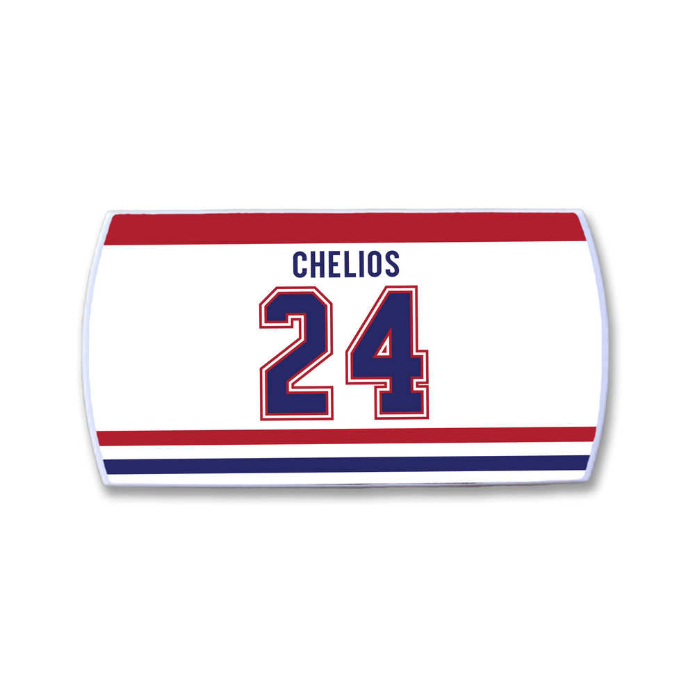 A ZippyBack™ Chris Chelios rectangular hockey jersey nameplate with CHELIOS and number 24 in blue and red on a white background, plus red and blue stripes at the bottom, inspired by legendary defenseman Chris Chelios.