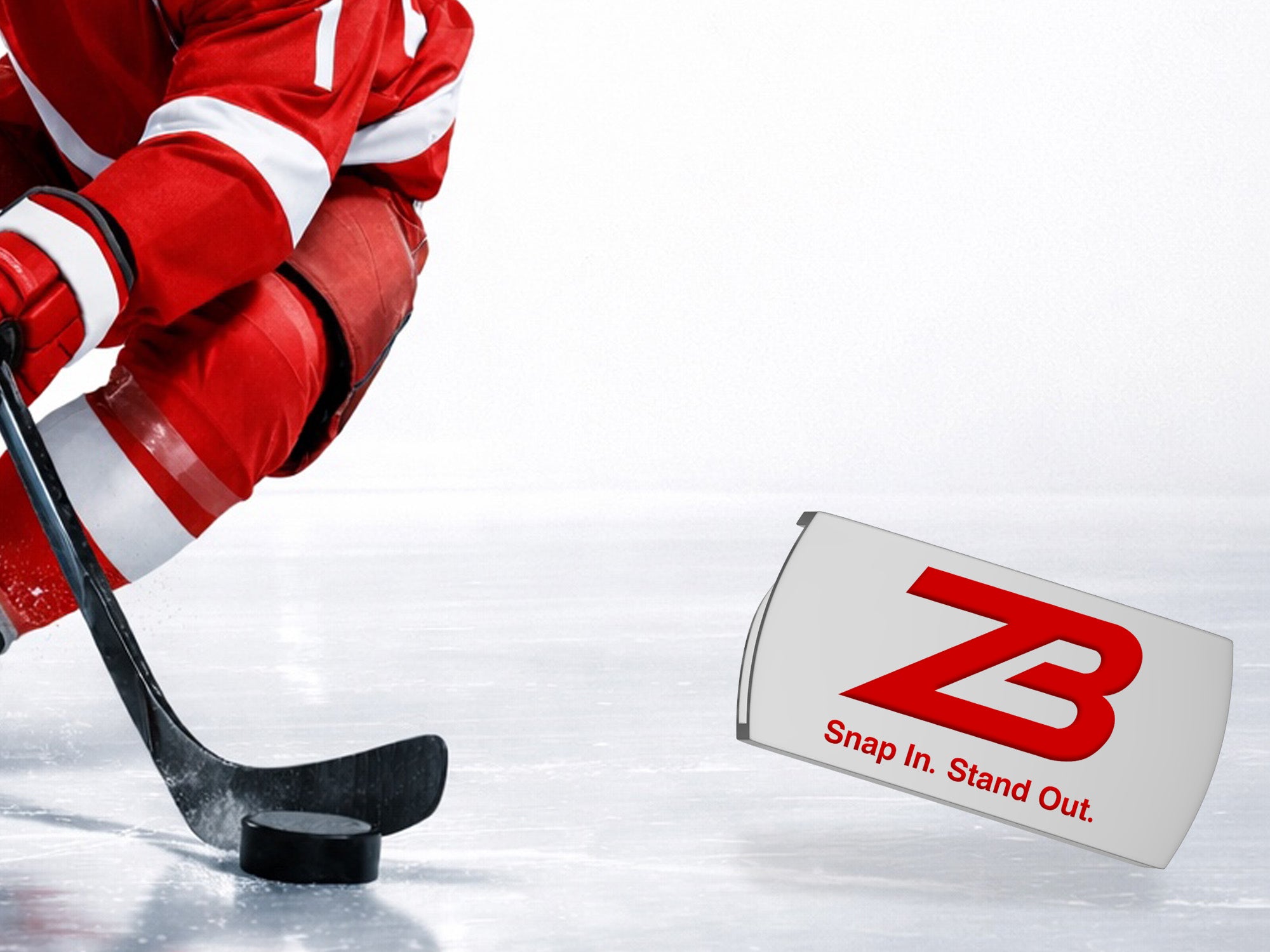 A hockey player in red gear skates on ice, positioning a stick near a black puck. To the right, a silver object displays a red ZB logo with the slogan Snap In. Stand Out.