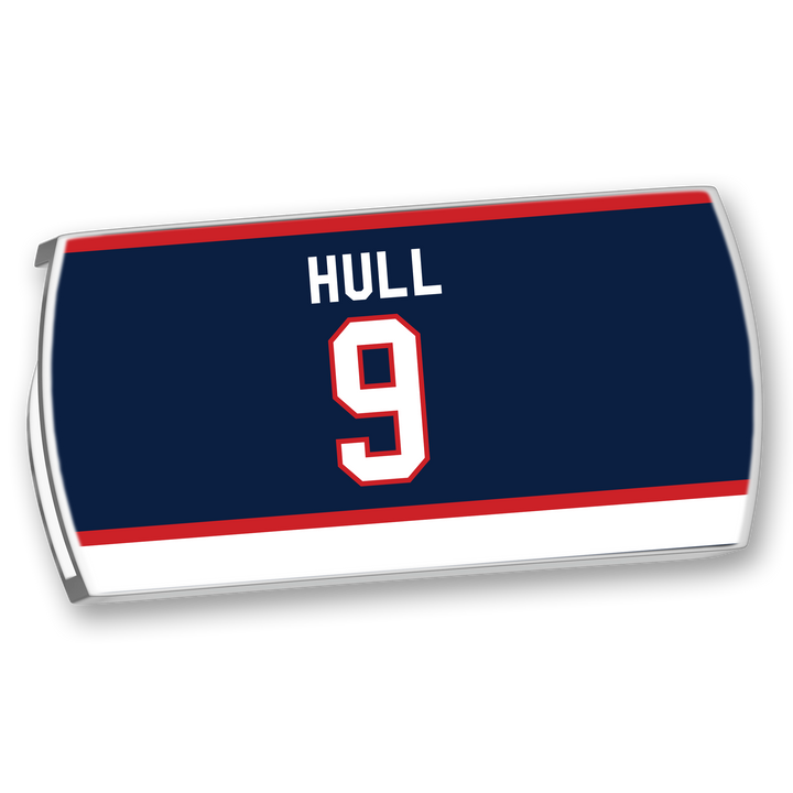 The ZippyBack™ Bobby Hull jersey is navy blue with white and red stripes, featuring HULL and number 9 on the back in white with a red outline—a tribute to the legendary scorer.