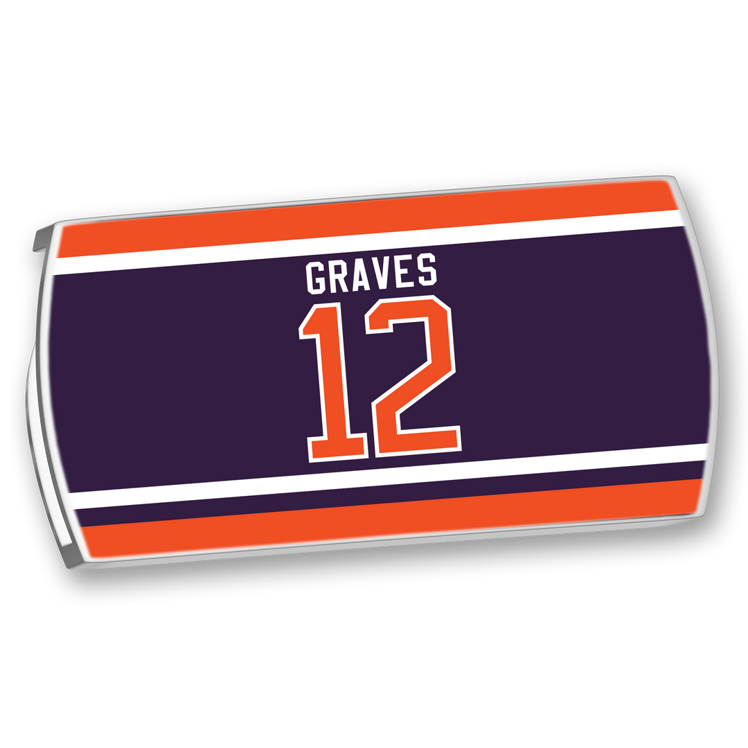The ZippyBack™ Adam Graves nameplate is a rectangular, navy blue sports jersey patch with "GRAVES" and the number 12 in white and orange, bordered by orange and white stripes.