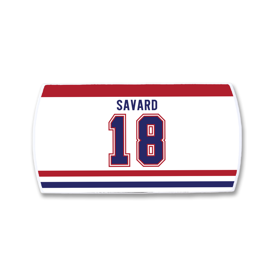 A ZippyBack™ Denis Savard hockey jersey nameplate in white, featuring "SAVARD" in blue above blue-outlined number 18, with red and blue stripes—honoring Denis Savard’s iconic legacy.