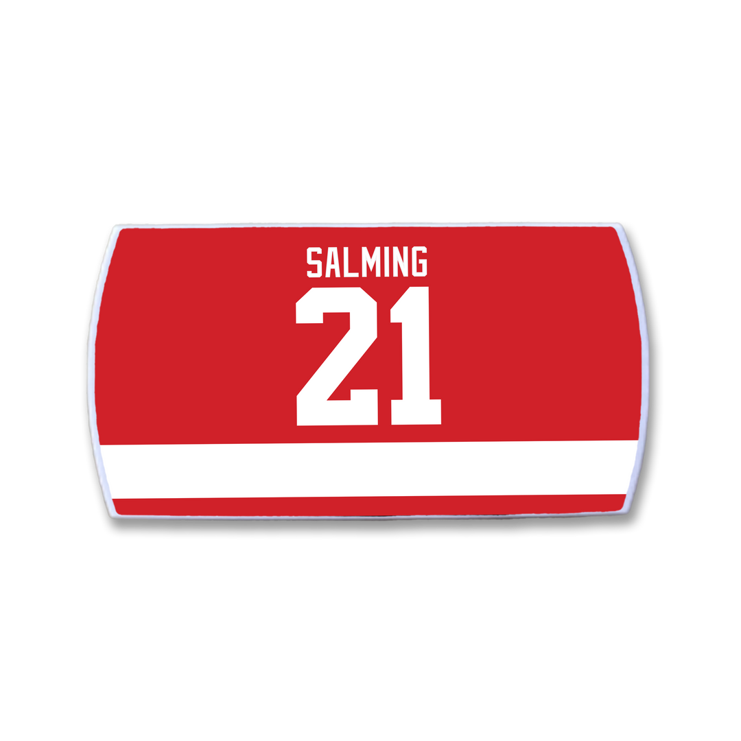 The ZippyBack™ Börje Salming hockey jersey nameplate features a bold white SALMING above the large white number 21 and a horizontal stripe, honoring his legacy of skill and toughness on the ice.