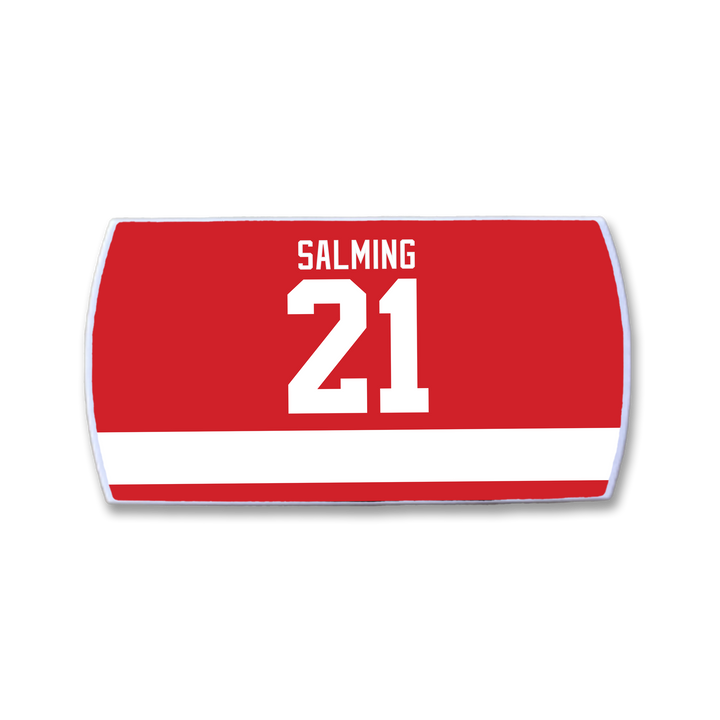 The ZippyBack™ Börje Salming hockey jersey nameplate features a bold white SALMING above the large white number 21 and a horizontal stripe, honoring his legacy of skill and toughness on the ice.