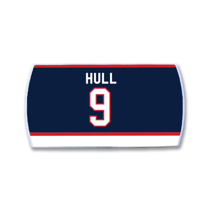 The ZippyBack™ Bobby Hull nameplate features "HULL" and number 9 in white with red trim on navy, bordered by red and white stripes—honoring legendary scorer Bobby Hull.