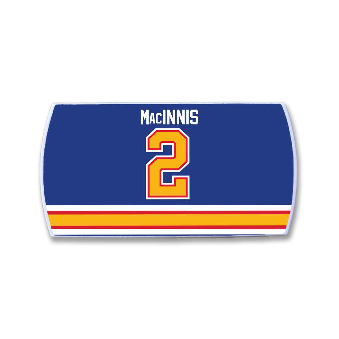 The ZippyBack™ Al MacInnis hockey jersey nameplate features "Al MacInnis" in white above a bold red and yellow number 2, with yellow, orange, and red horizontal stripes along the bottom—a tribute to the slapshot legend.