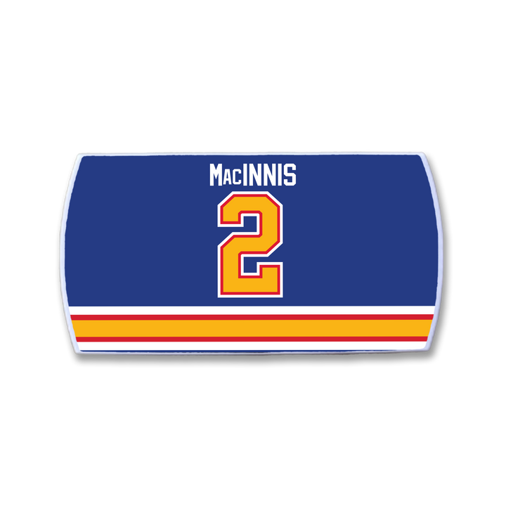 The ZippyBack™ Al MacInnis hockey jersey nameplate features "Al MacInnis" in white above a bold red and yellow number 2, with yellow, orange, and red horizontal stripes along the bottom—a tribute to the slapshot legend.