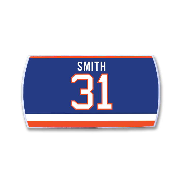 The ZippyBack™ Billy Smith badge is blue and rectangular with a white and orange border, featuring his name above a bold white and orange 31, honoring his hockey career, plus two horizontal stripes at the bottom—one white, one orange.