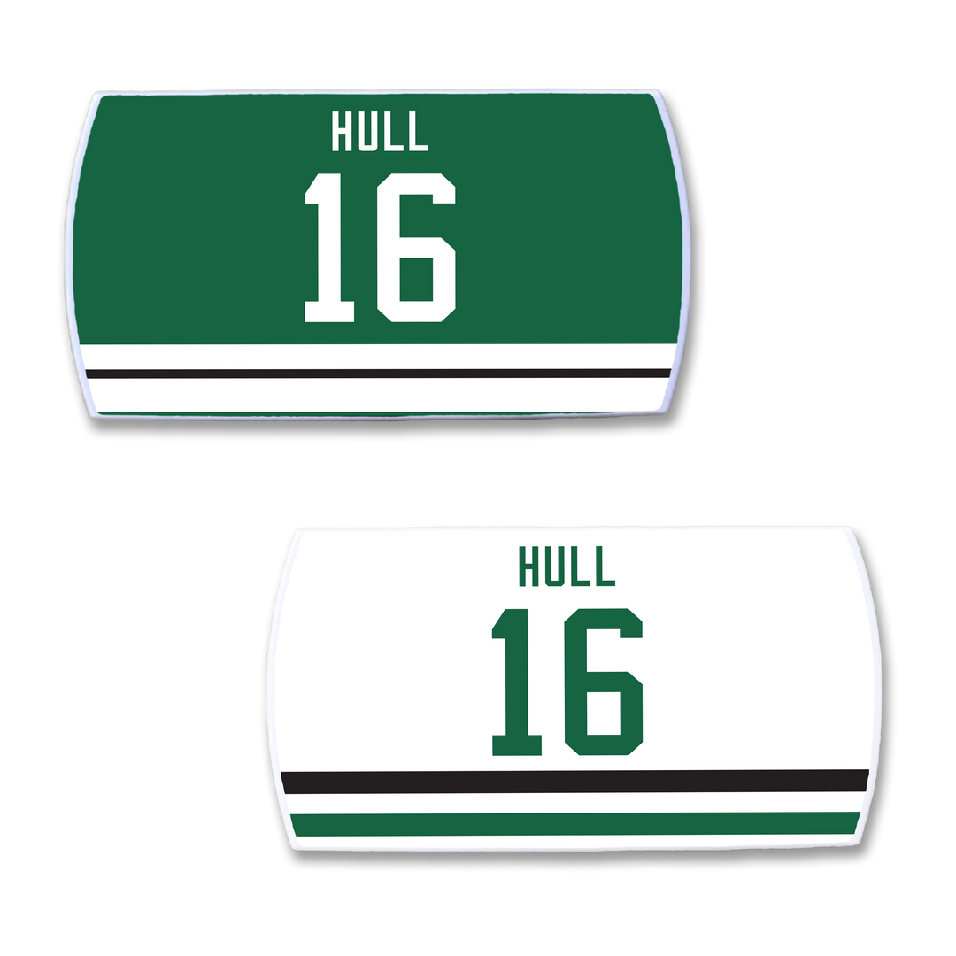 Two rectangular ZippyBack™ Brett Hull hockey jersey nameplates: one green with white "HULL 16" text, one white with green "HULL 16" text. Both feature bottom stripes inspired by Hull&