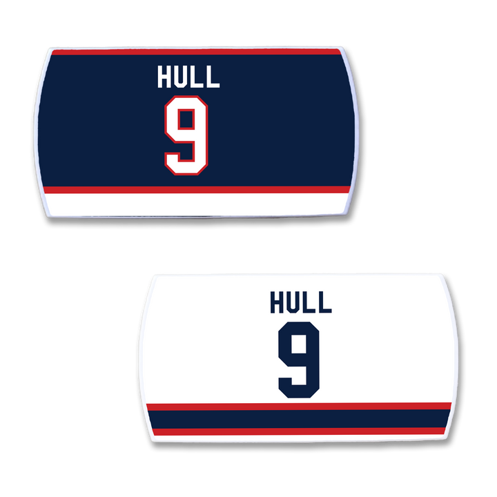 Two ZippyBack™ Bobby Hull hockey jersey nameplates: one dark blue with "HULL" and 9 in white/red, and one white with "HULL" and 9 in black, accented by red/blue stripes.