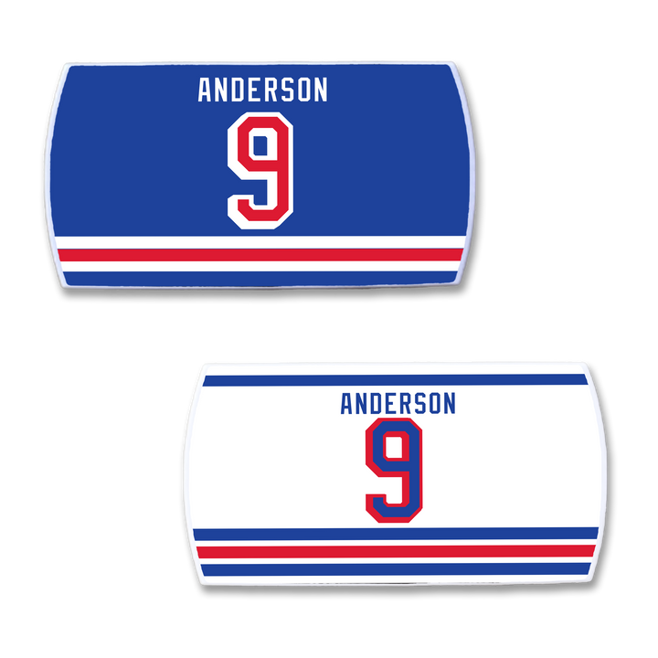Two rectangular ZippyBack™ Glenn Anderson hockey jersey nameplates: one blue, one white, both with ANDERSON and number 9 above red and white stripes—honoring his legendary postseason clutch scoring.