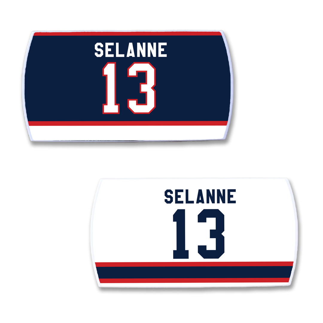 Two ZippyBack™ Teemu Selänne hockey jersey nameplates: one navy with "Selänne" and 13 in white/red, the other white with "Selänne" and 13 in navy, both featuring bold red and blue stripes.