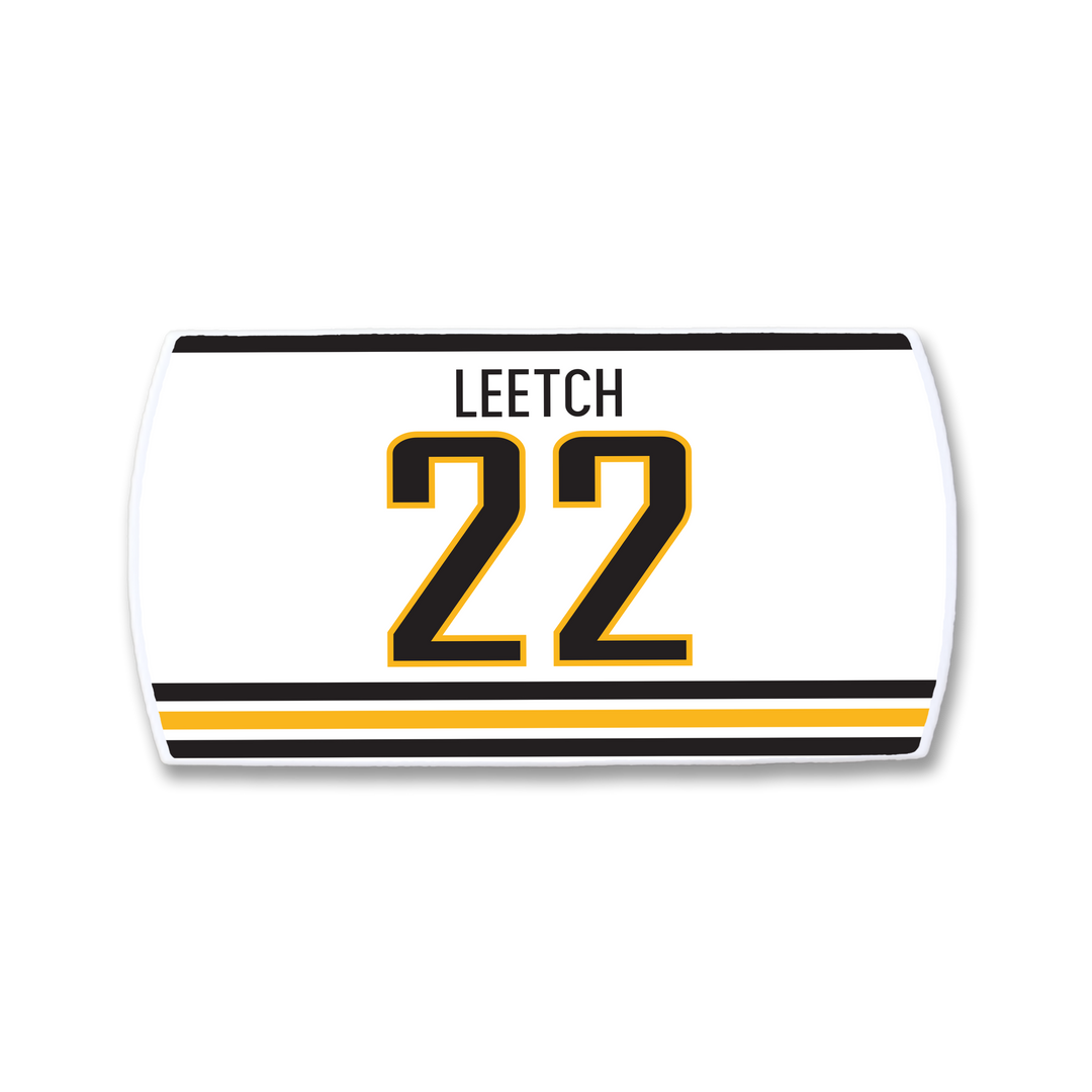 The ZippyBack™ Brian Leetch nameplate is a white hockey jersey patch with black and gold stripes, featuring LEETCH above the bold black-and-gold number 22, honoring the legendary defenseman.