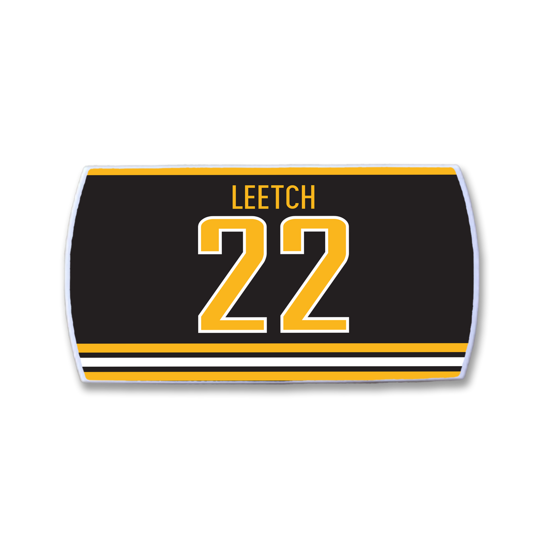 A rectangular ZippyBack™ patch features a black background, the name Brian Leetch in yellow above the number 22 in bold yellow and white, plus matching stripes at the bottom.