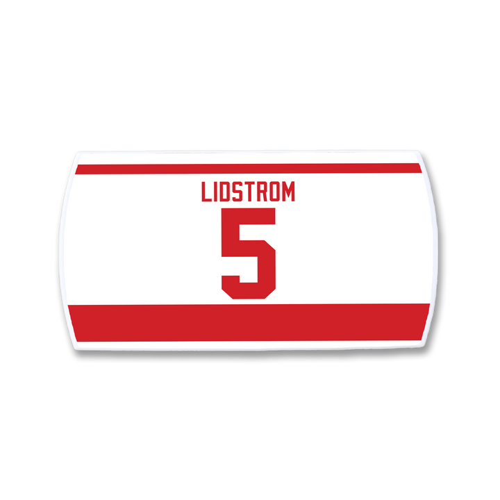 The ZippyBack™ Nicklas Lidström nameplate is a white and red hockey jersey patch featuring "LIDSTROM" and the number 5 in bold red, celebrating the legendary defenseman.