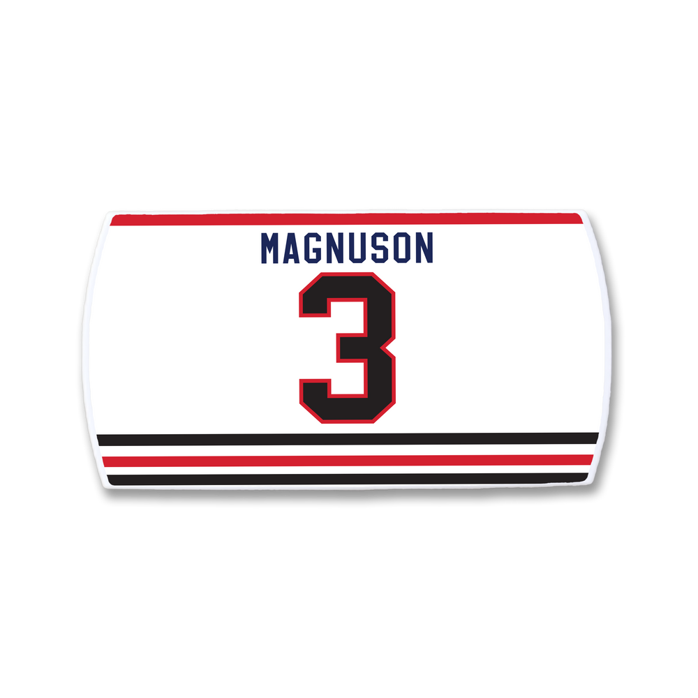 The ZippyBack™ Keith Magnuson jersey is a white sports top with "Magnuson" in blue above a bold red and black number 3, plus striking black and red stripes near the hem to honor the legendary defenseman.