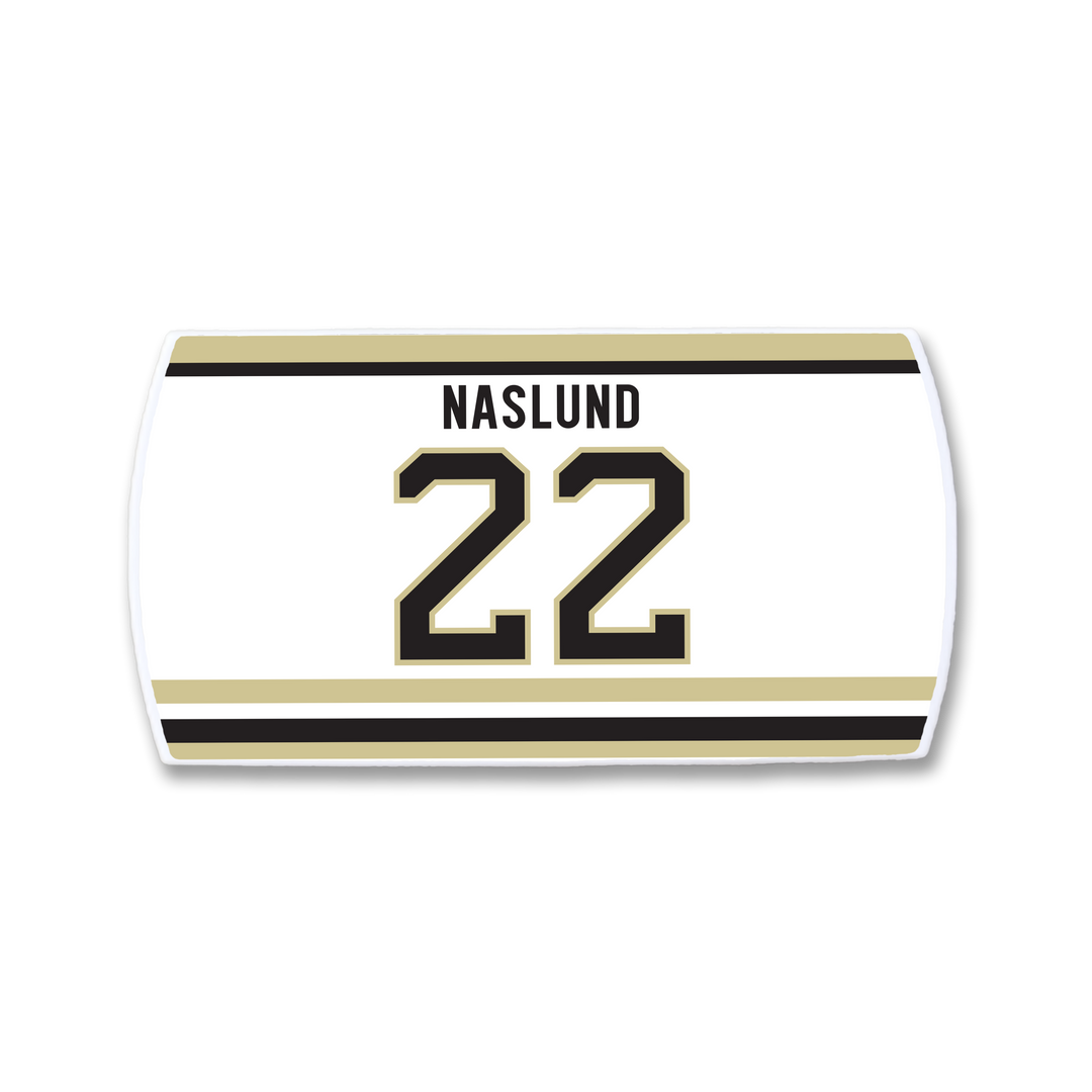 The ZippyBack™ Markus Näslund nameplate features white fabric with gold and black stripes, his name above the number 22 in bold black with gold outline—a fitting tribute to the legendary scorer’s offensive impact.