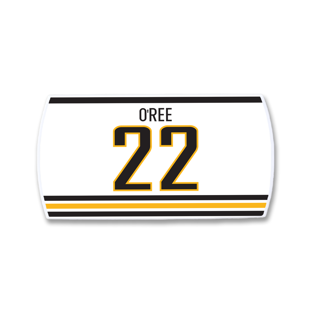 The ZippyBack™ Willie O’Ree nameplate features his name in black above the number 22, outlined in black and gold, with two horizontal black and gold stripes below, honoring a forward who changed hockey history.