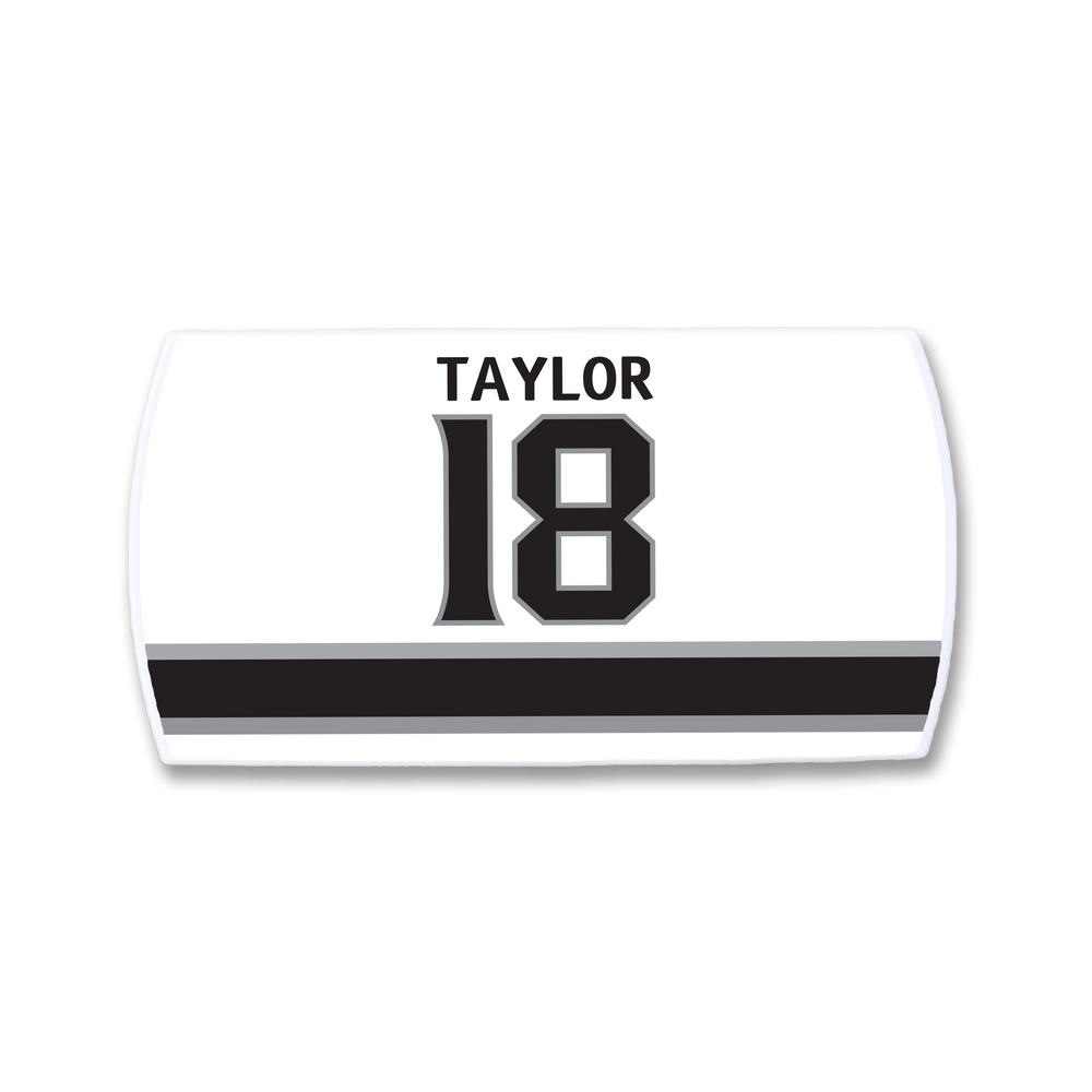 The ZippyBack™ Dave Taylor nameplate is a white sports jersey patch featuring TAYLOR above the number 18 in black, accented by two horizontal black stripes below.