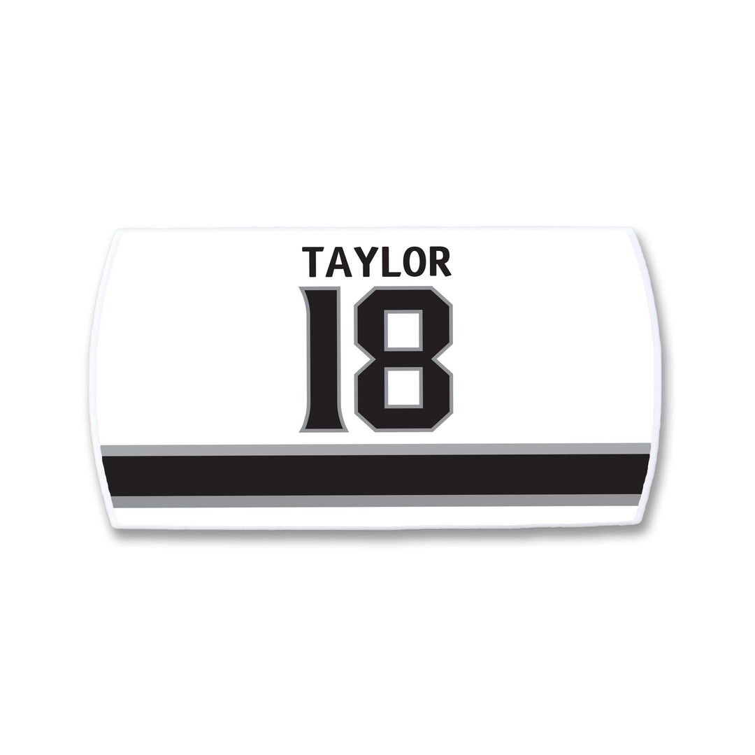 The ZippyBack™ Dave Taylor nameplate is a white sports jersey patch featuring TAYLOR above the number 18 in black, accented by two horizontal black stripes below.