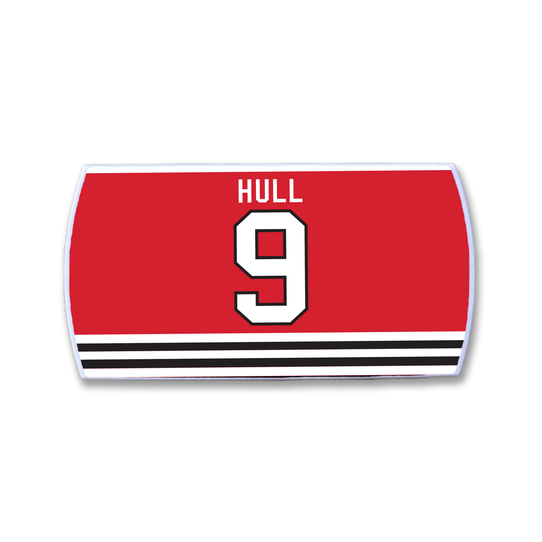 The ZippyBack™ Bobby Hull jersey features bold red with HULL and number 9 in white and black above black-and-white stripes—a must-have for any Bobby Hull fan.