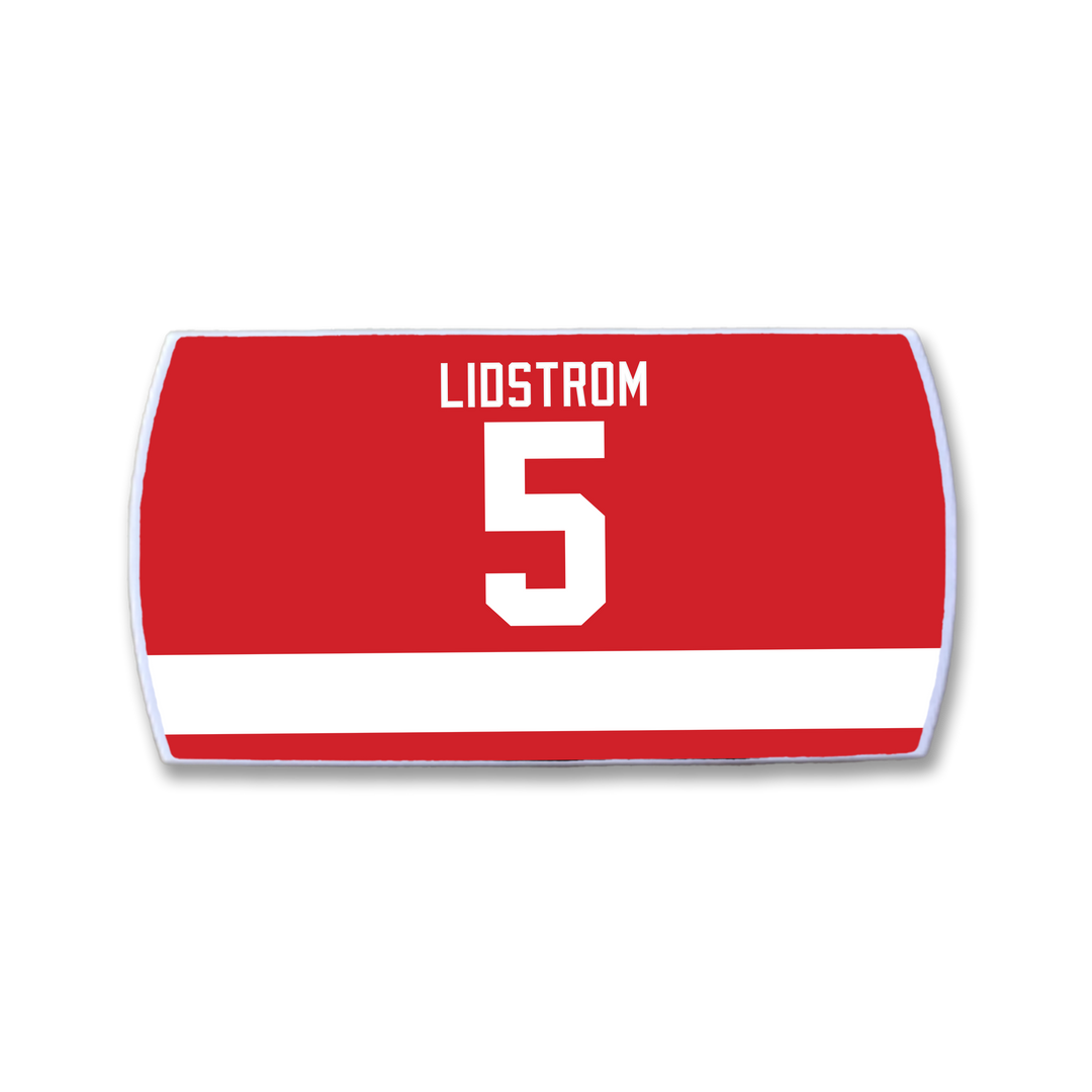 The ZippyBack™ Nicklas Lidström nameplate is a red hockey jersey patch with a white stripe, featuring LIDSTROM and the number 5 in bold white.