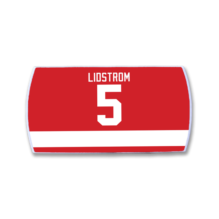 The ZippyBack™ Nicklas Lidström nameplate is a red hockey jersey patch with a white stripe, featuring LIDSTROM and the number 5 in bold white.
