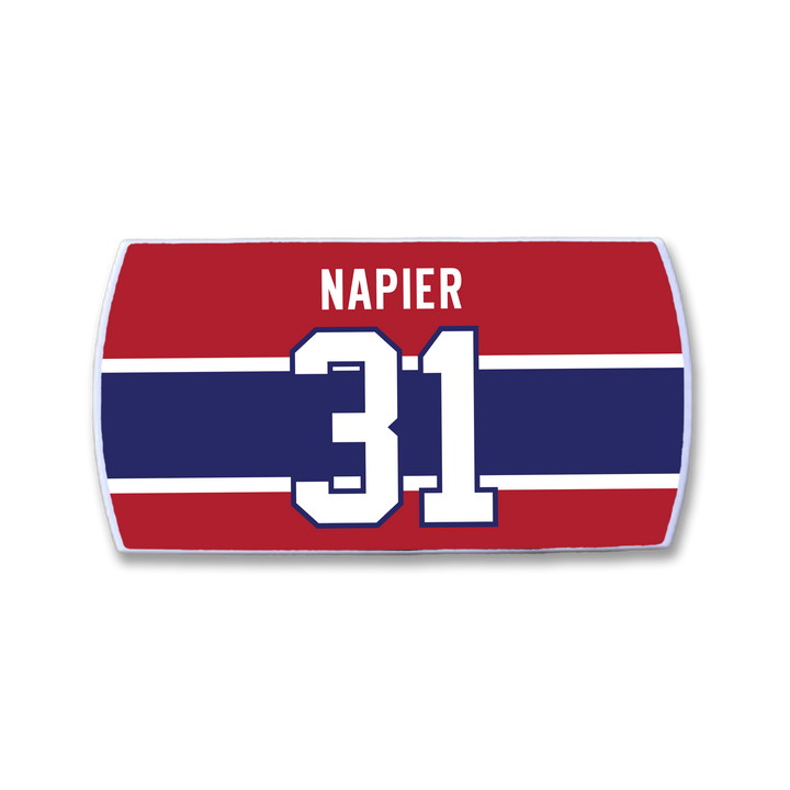A red, white, and blue rectangular ZippyBack™ nameplate featuring "Mark Napier" above a large white number 31—a nod to his goal-scoring skills and sharp offensive instincts.