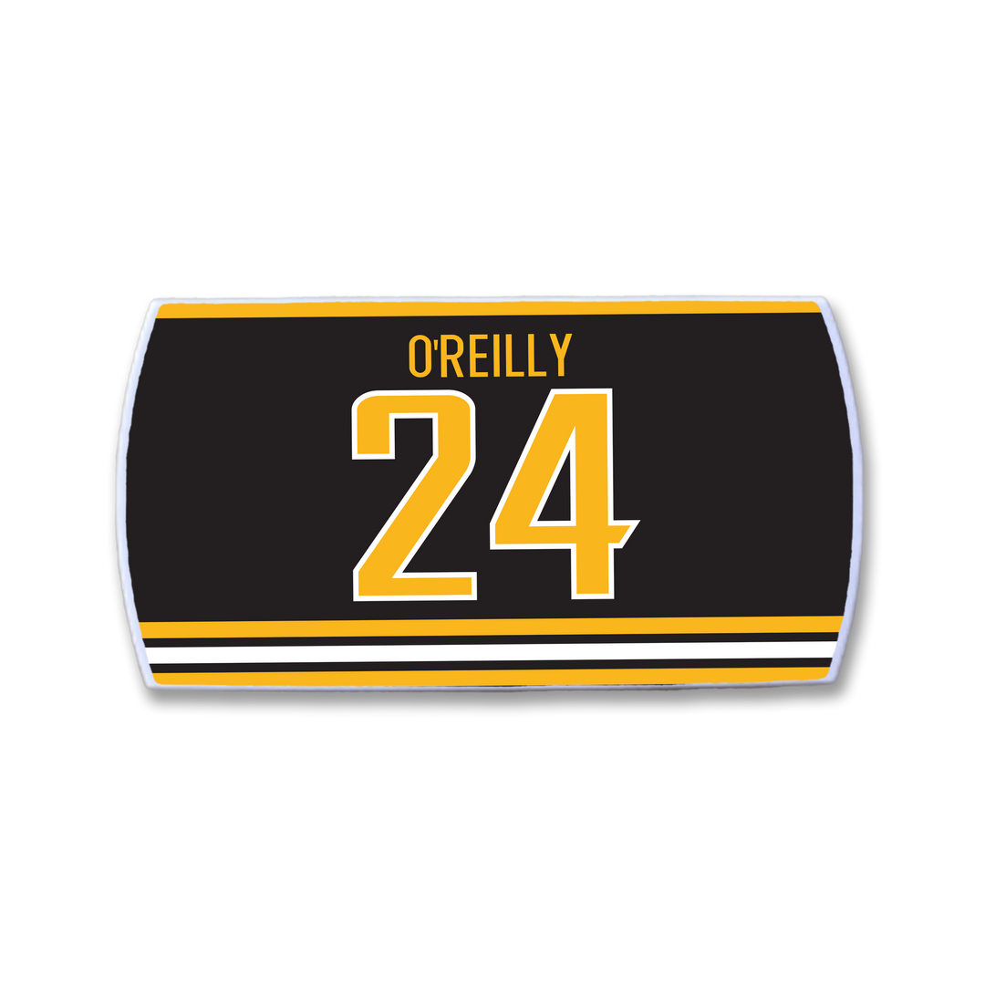 Celebrate Terry O’Reilly with this ZippyBack™ hockey jersey nameplate, featuring "OREILLY" in yellow above 24, accented by yellow and white stripes on a black background—a true tribute to a legendary team leader.