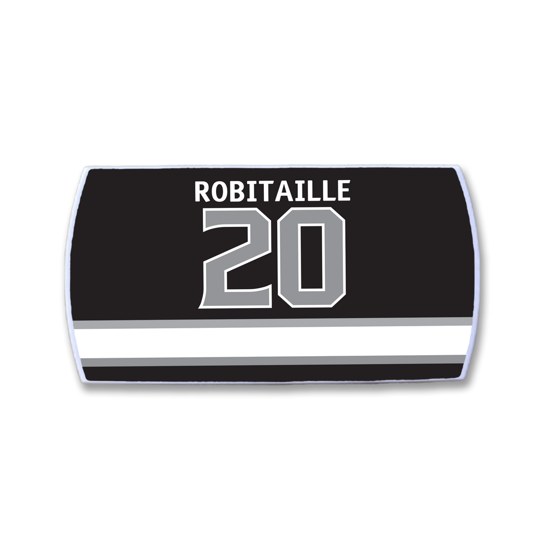 The ZippyBack™ Luc Robitaille black hockey jersey nameplate displays his name in white above the number 20, with bold white and silver horizontal stripes underneath.